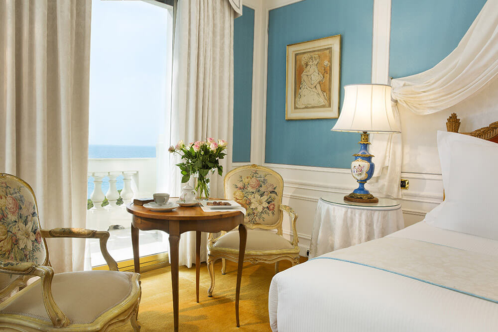 Le Negresco Luxury Hotel suite in blue and white