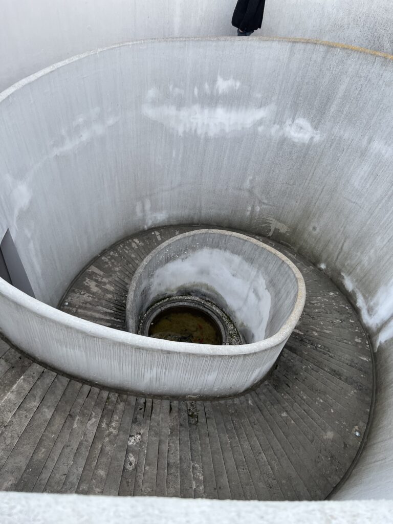 Spiral staircase to Dei cellar